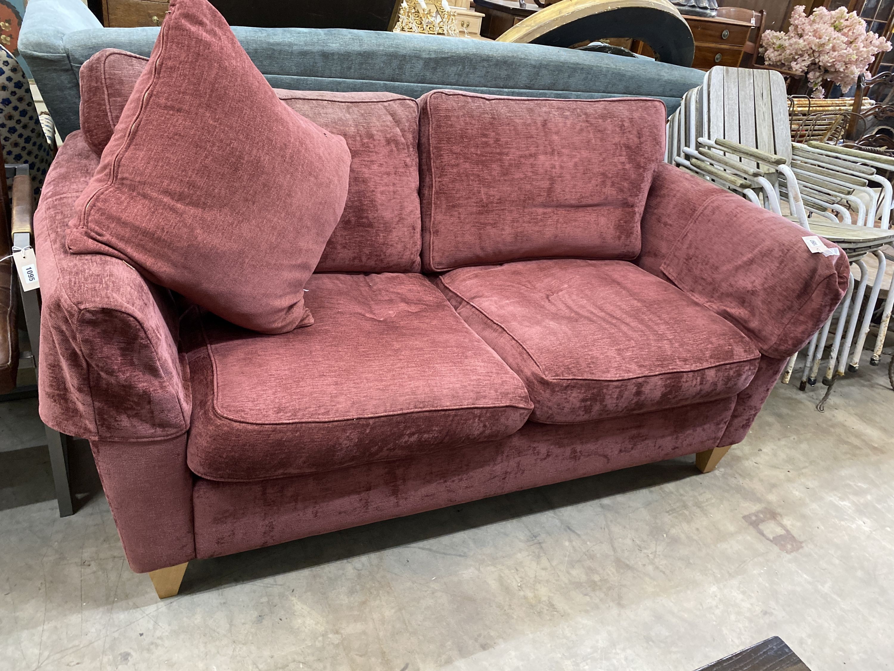 A contemporary plum fabric two seater settee, length 176cm, depth 84cm, height 86cm